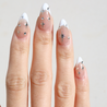 Light skinned hand with Chrome Celestial French Tip Nails