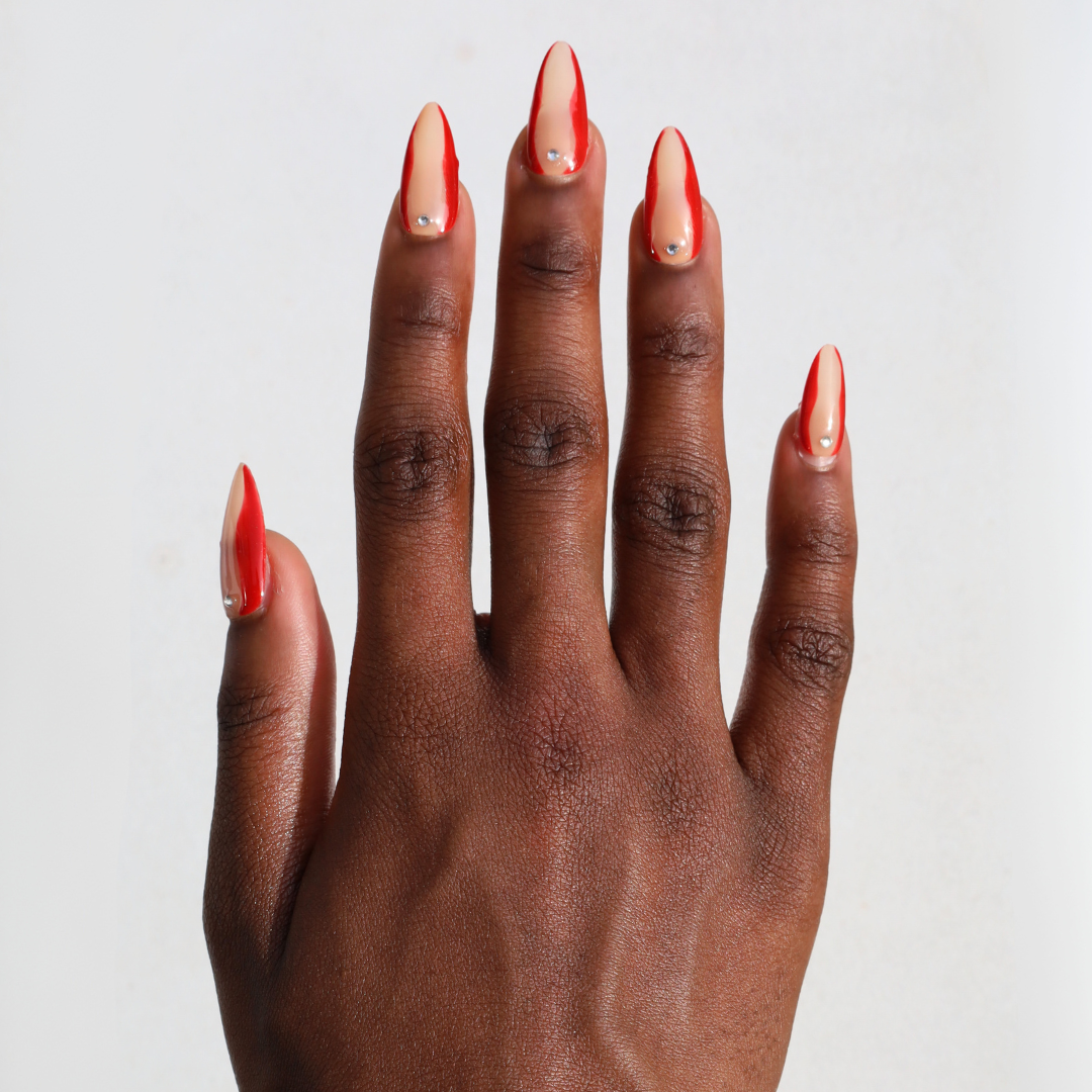 Dark skinned hand with Red Accent with Gems Nails