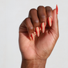 Dark skinned hand with Red Accent with Gems Nails