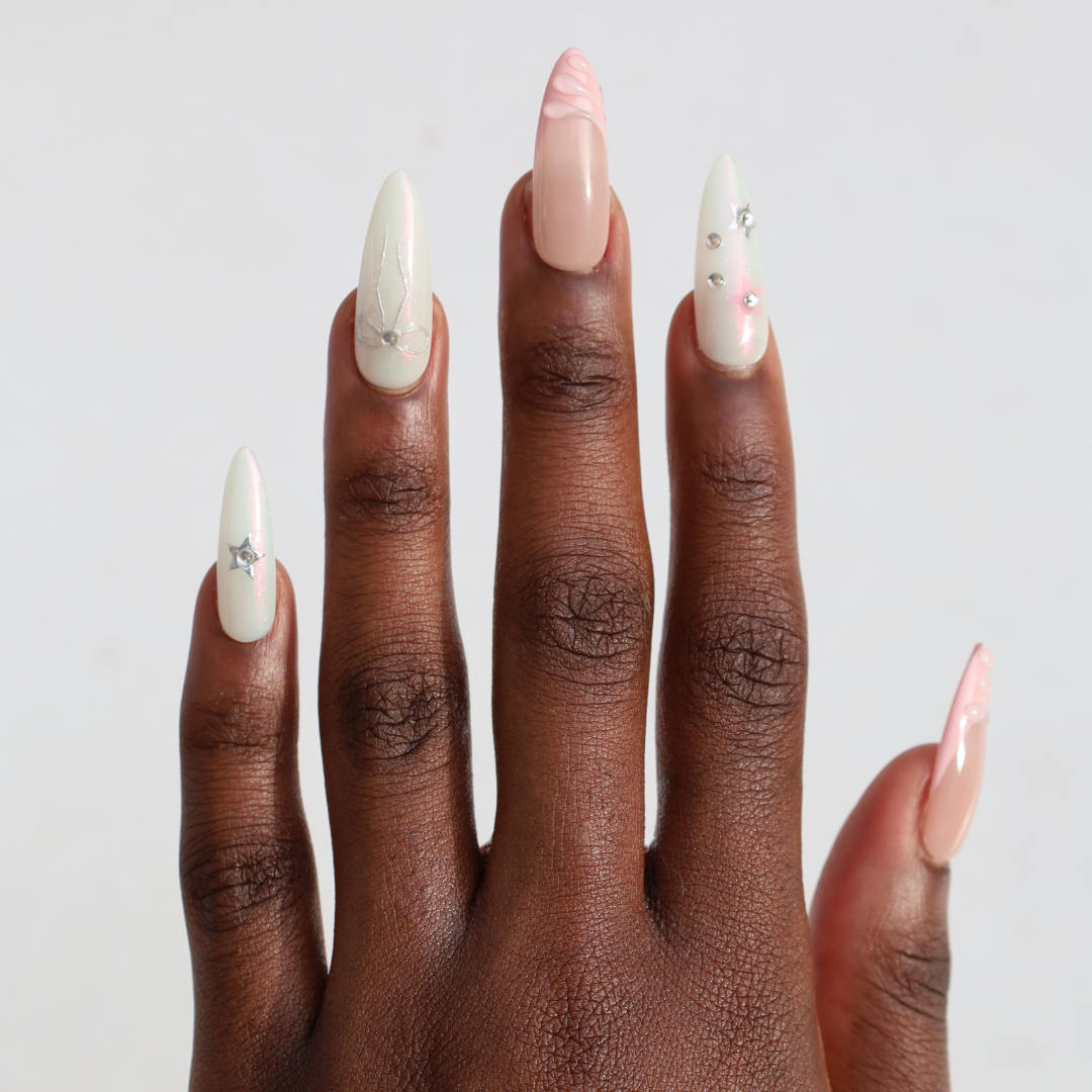 Dark skinned hand with Pastel Glazed 3D Bow Nails