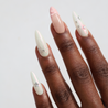 Dark skinned hand with Pastel Glazed 3D Bow Nails