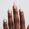Dark skinned hand with Pastel Glazed 3D Bow Nails