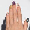Light skinned hand with Freestyle 3D Chrome Nails