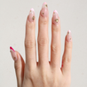 Light skinned hand with Celestial Winter Pink French Tips