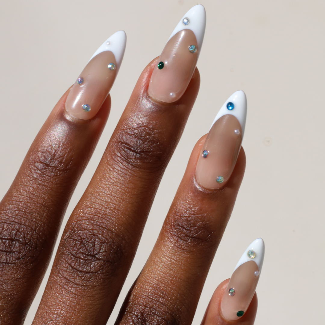 Angled photo of dark skinned hand with Colorful Pearl Long French Tip Nails