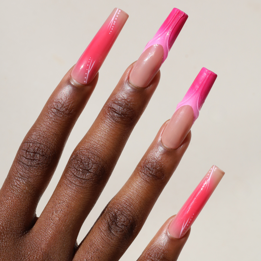 Angled photo of dark skinned hand with Pink Aura 3D Coffin Nails