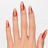 Light skinned hand with Red Accent with Gems Nails