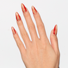 Light skinned hand with Red Accent with Gems Nails