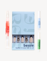 Long, almond shaped press on nails. Nude french design with blue detail on light toned hand