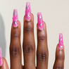 Dark skinned hand with Chrome Pink Coffin Nails