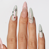 Light skinned hand with Pastel Glazed 3D Bow Nails