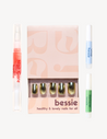 Long, almond shaped press on nails. Nude french design with blue detail on dark toned hand