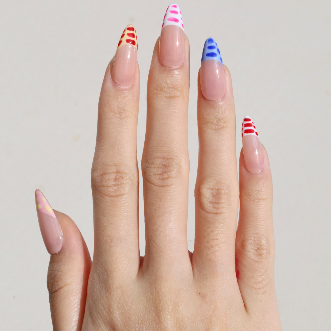 Light skinned hand with Crocodile French Tips