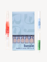 light toned hand holding box of long almond pinky nude press on nail 