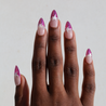Dark skinned hand with Pink Star Chrome French Tips