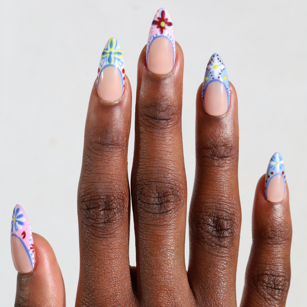 Dark skinned hand with Colorful Mediterranean Porcelain Nails