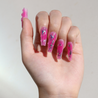 Light skinned hand with Chrome Pink Coffin Nails