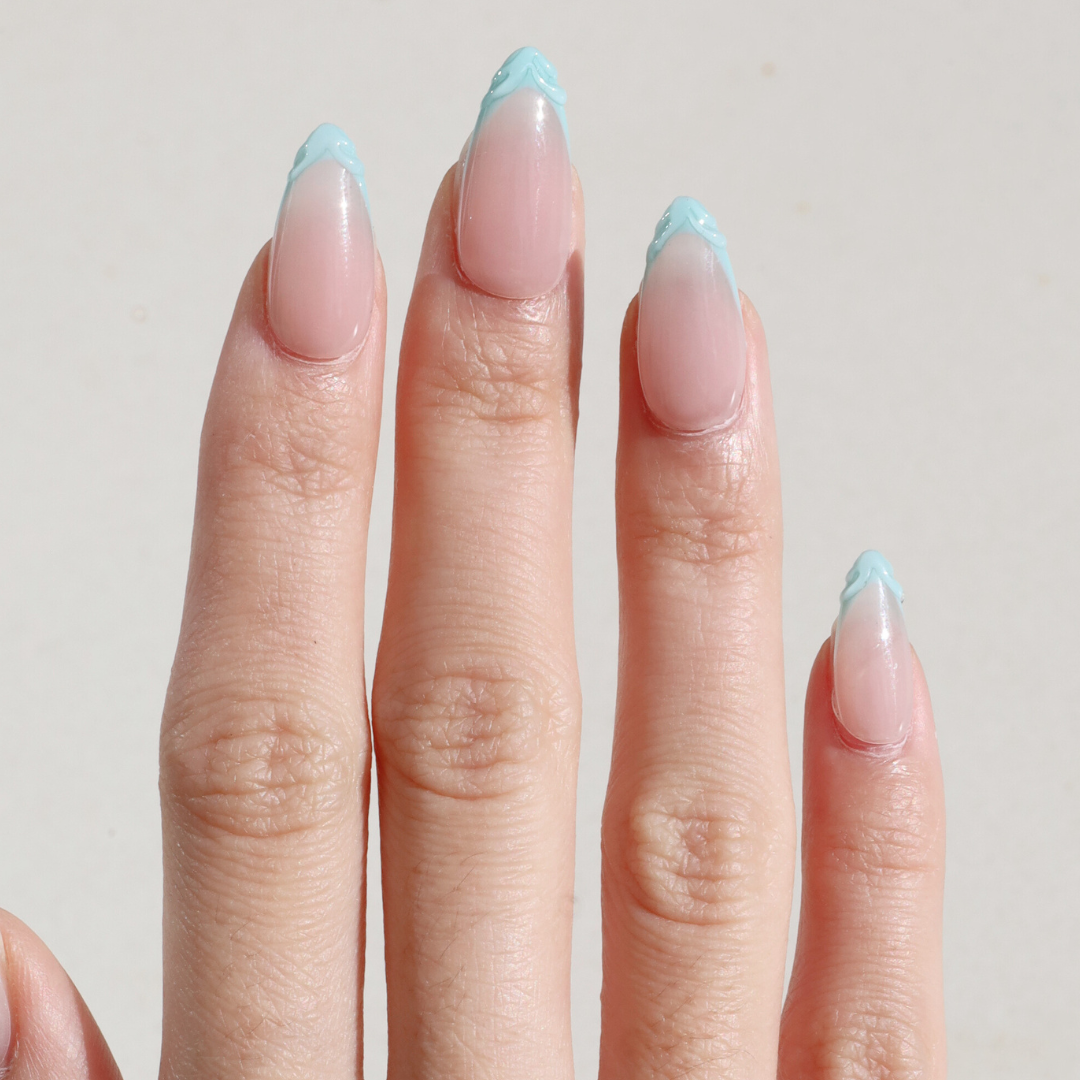 Light skinned hand with Mermaid 3D French Tip Nails