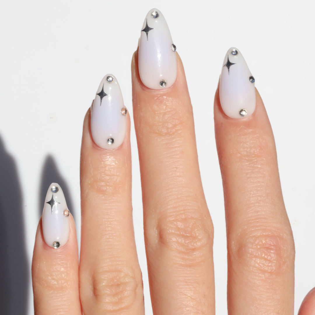 Light skinned hand with Celestial Blue Aura Nails
