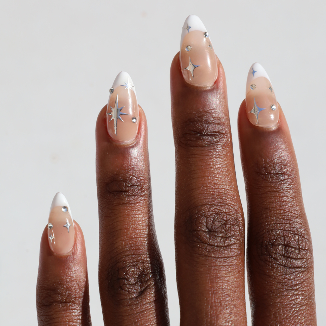 Model with long almond rose gold sparkly press on nail