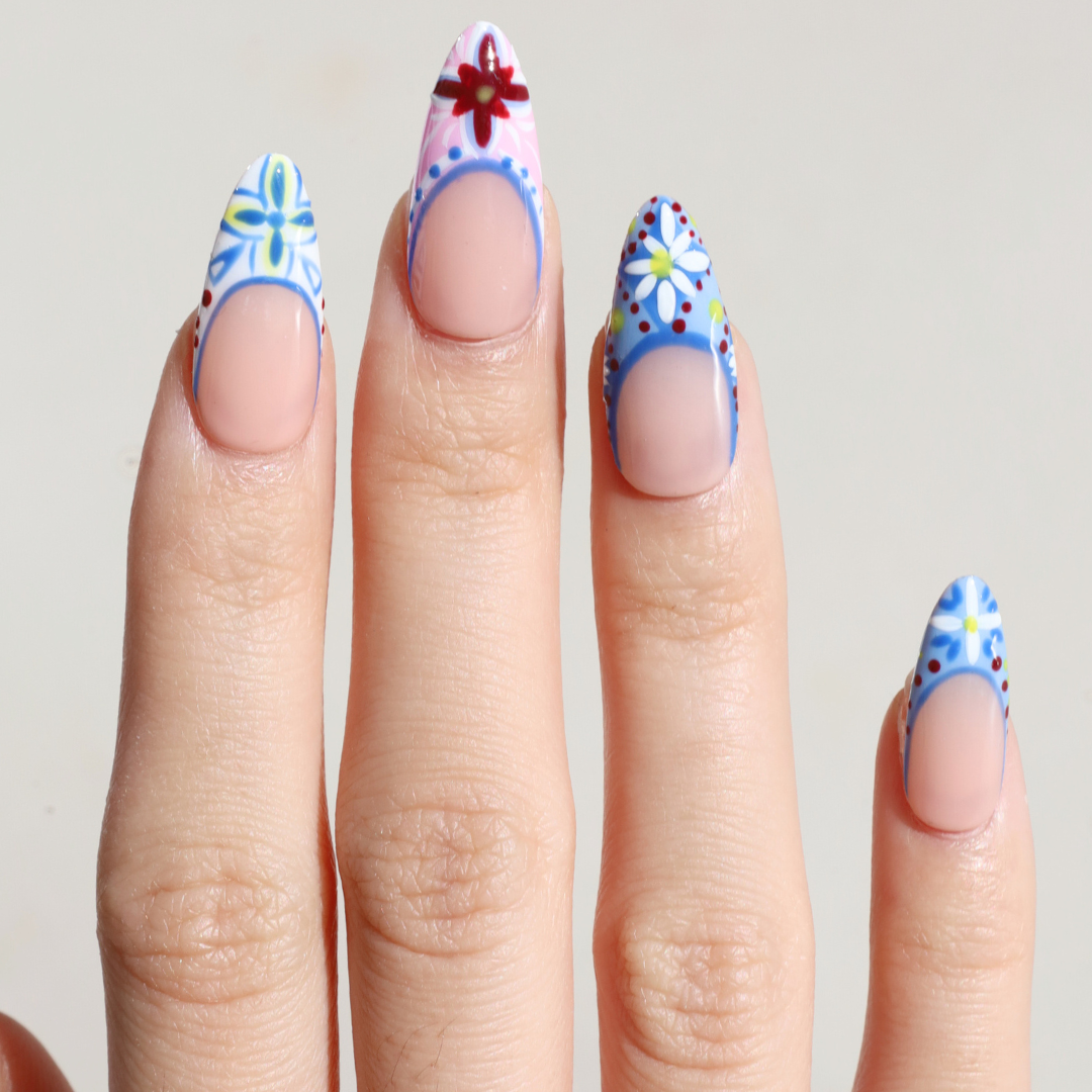 Light skinned hand with Colorful Mediterranean Porcelain Nails