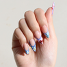 Light skinned hand with Colorful Mediterranean Porcelain Nails