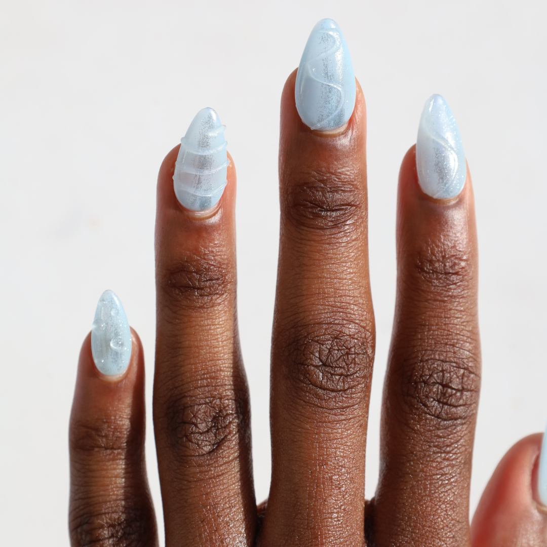 Dark skinned hand with Blue Frost Nails