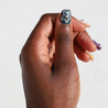 Dark skinned thumb with Freestyle 3D Chrome Nails