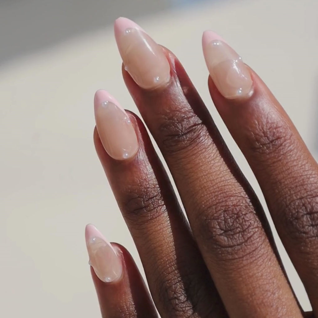 Video of dark skinned hand with Pearl Nude French Tip Nails
