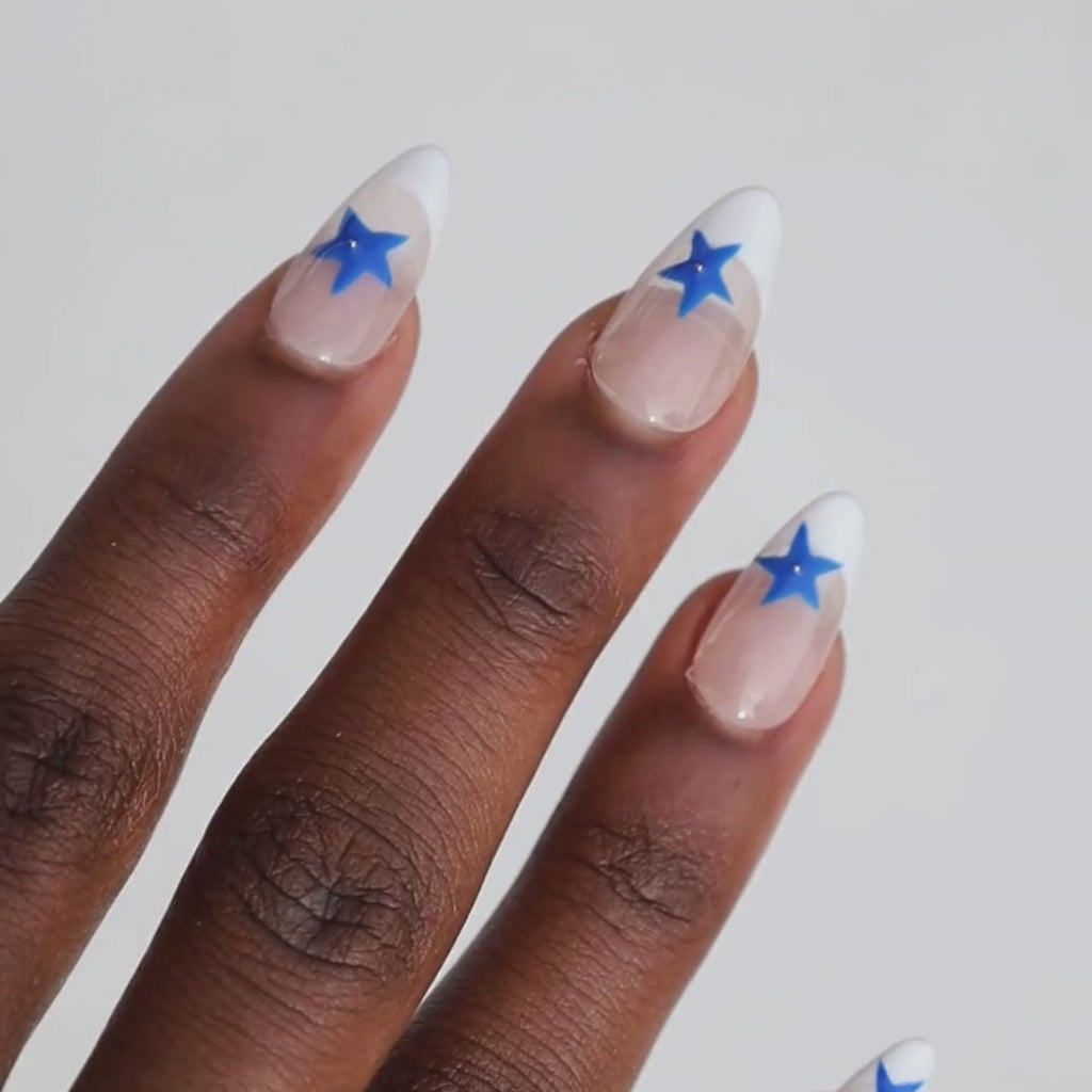 Video of dark skinned hand with Blue Star French Tips
