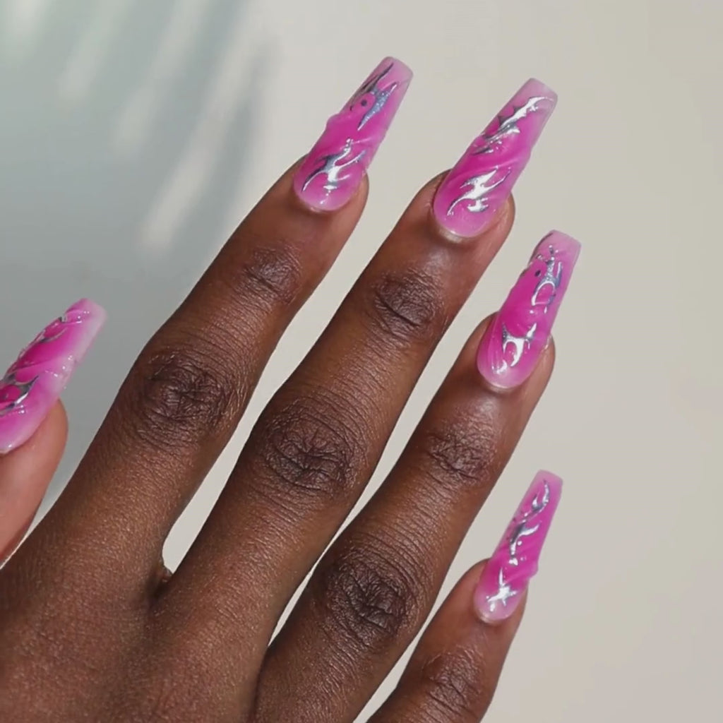Video of dark skinned hand with Chrome Pink Coffin Nails