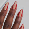Video of dark skinned hand with Red Accent with Gems Nails