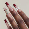 Video of dark skinned hand with Cherry 3D Bow Coffin Nails