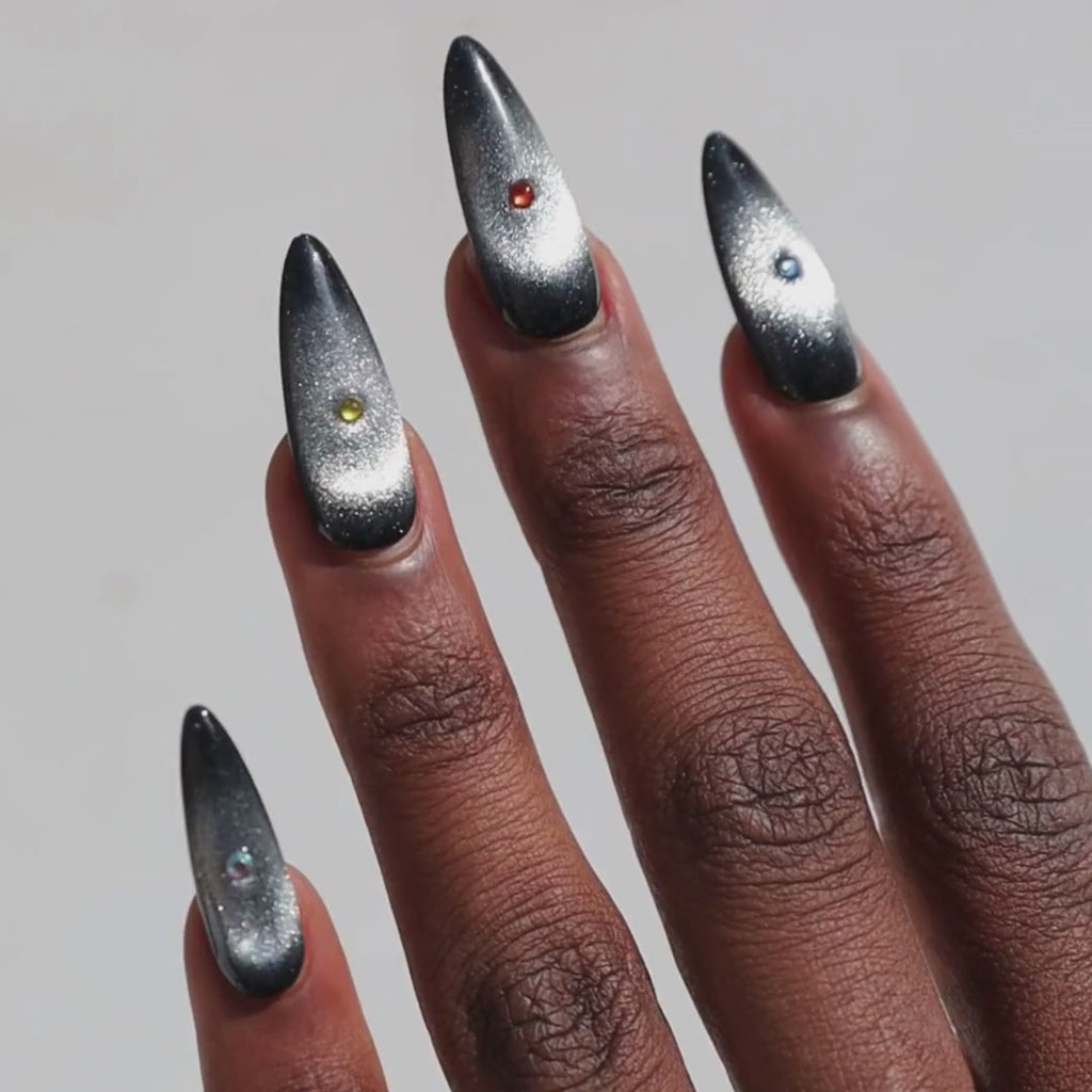 Video of dark skinned hand with Black Cateye Gem Nails