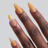 Video of dark skinned hand with Orange Chrome Moderne Nails