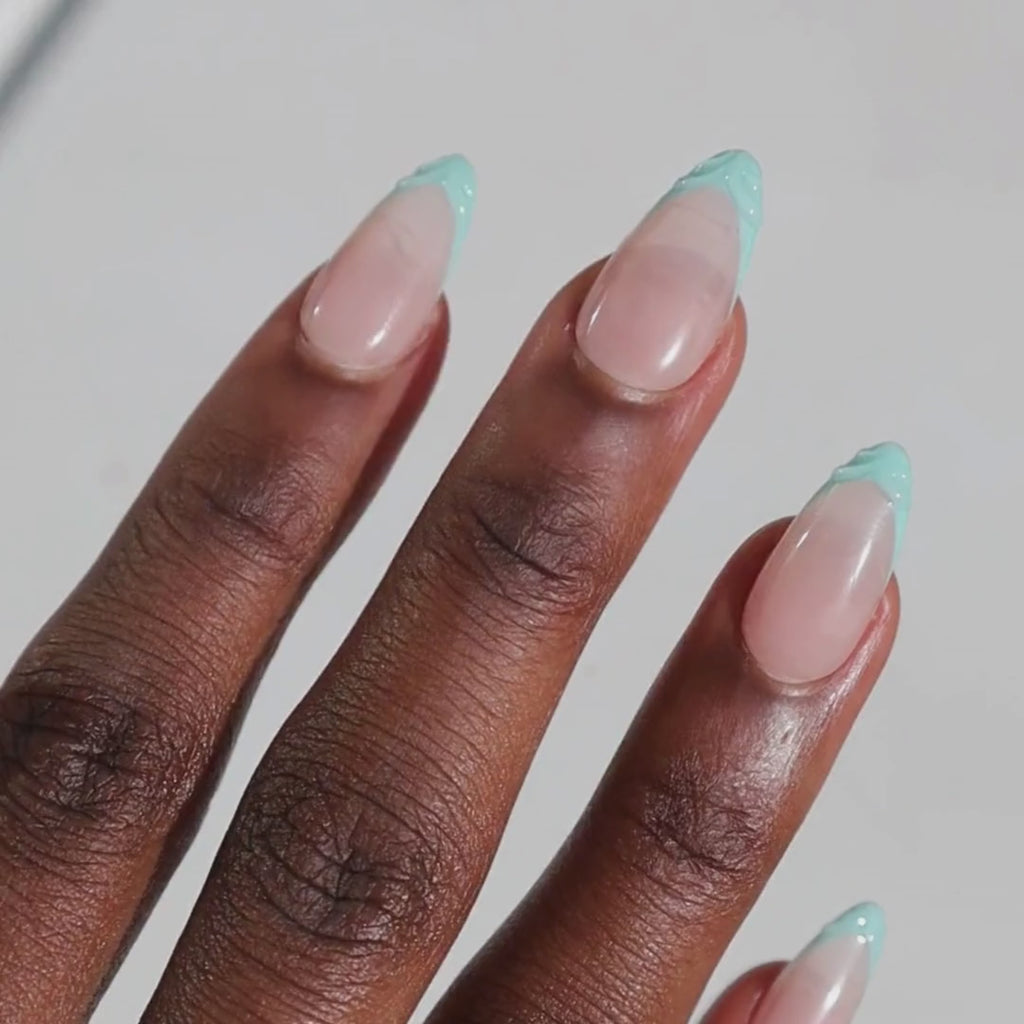 Dark skinned hand with Mermaid 3D French Tip Nails