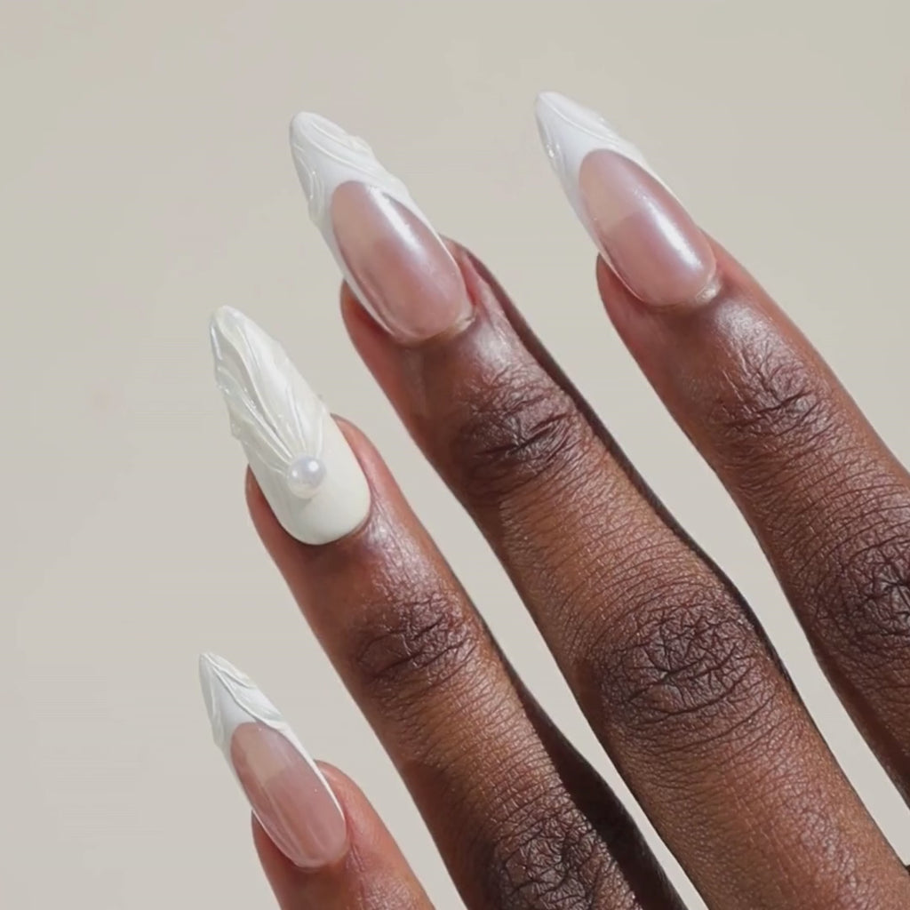 Video of dark skinned hand with Winter Pearl French Tip Nails