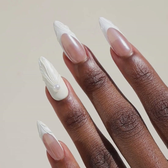 Video of dark skinned hand with Winter Pearl French Tip Nails