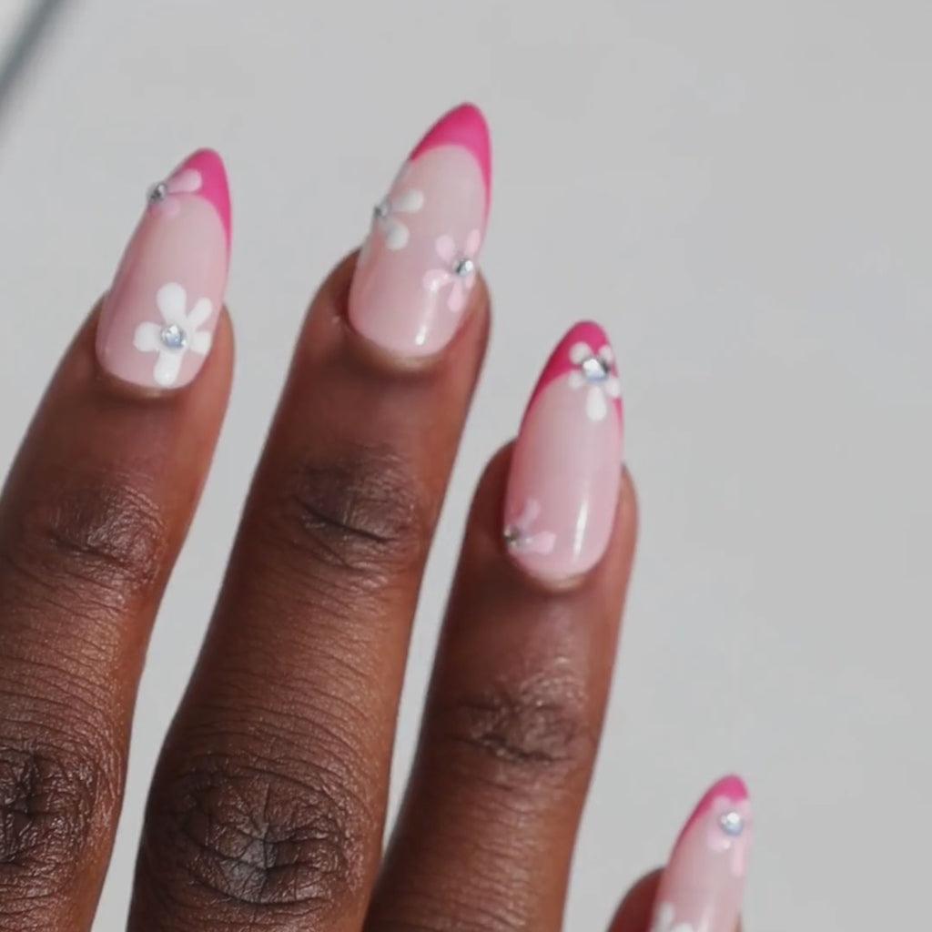 Video of dark skinned hand with Pink Gem Floral French Tips